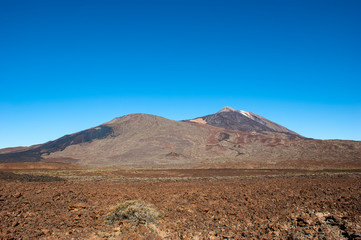 The top of the Teide volcano. The valley of the Teide volcano. In the distance, you can see the frozen lava which was flowing down the slope of Pico Viejo.
