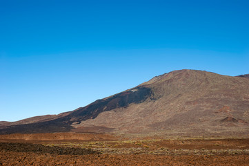 The top of the Teide volcano. The valley of the Teide volcano. In the distance, you can see the frozen lava which was flowing down the slope of Pico Viejo.