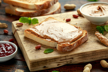 Fototapeta na wymiar Peanut Butter Sandwich on wooden board. morning breakfast