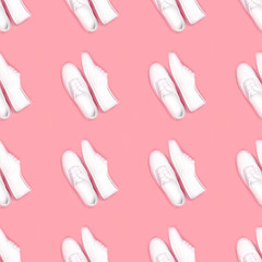 Seamless pattern. White women's gym shoes in a symmetrical order on a pink background. Fashion, style.