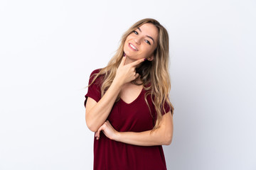 Young woman over isolated white background smiling