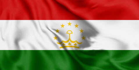 Obraz premium Tajikistan flag blowing in the wind. Background silk texture. 3d illustration.