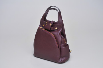 Women's leather bag on a gray background