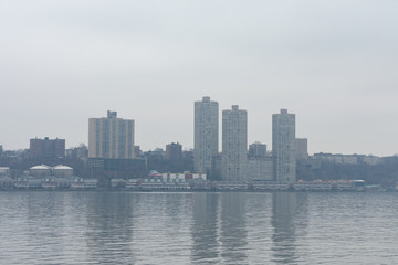 Fototapeta na wymiar Skyline of West New York and Guttenberg New Jersey on a Foggy Day along the Hudson River