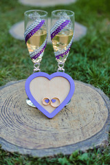 Fototapeta premium Box with rings and glasses with champagne. Place for inscription