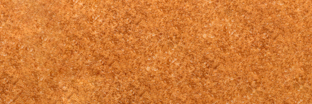 Textured background of fresh homemade golden crepe or thin pancake. Banner. Space for recipe.