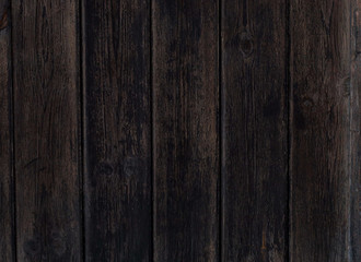 Fototapeta premium The use of vertical planks of dark wood for background