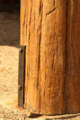 Pillars of rural Thai houses made from logs.