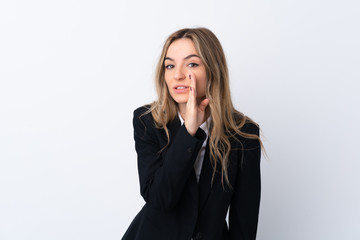 Young business woman over isolated white background whispering something