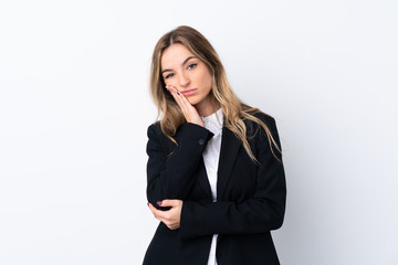 Young business woman over isolated white background unhappy and frustrated