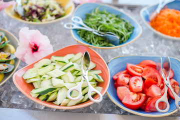 Close up of salad bar with assortment of ingredients