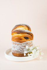 Beautiful lace Easter cake with raisins on a pastel tone. Vertical photo.