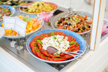 Close up of salad bar with assortment of ingredients