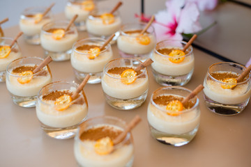 The catering wedding buffet. Wedding reception dessert table with delicious decorated white cupcakes with berries closeup.