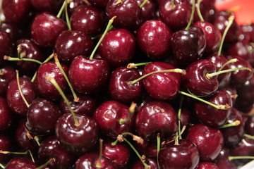 Top view, Closed up heap of cherry background texture in basket and sale in the market.