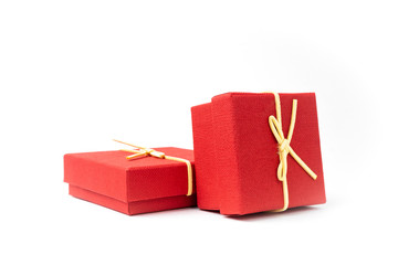 Surprise in flying boxes wrapped in red gift paper with bow on white background. Concept of holidays and greeting cards. Copy space.