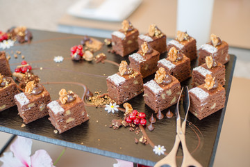 Chocolate Nut Brownie Cake decorated with Strawberries in Luxury Restaurant for Brunch, Buffet Concept