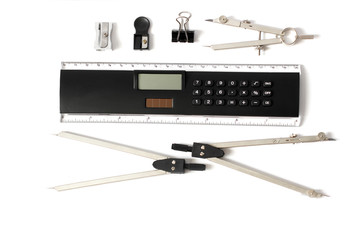 Divider, ruler, calculator, sharpener. Office supplies on a white background