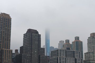 Fototapeta premium Skyscrapers in the Lincoln Square New York City Skyline along the Hudson River on a Foggy Day