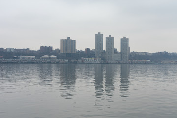 Fototapeta na wymiar Skyline of West New York and Guttenberg New Jersey on a Foggy Day along the Hudson River