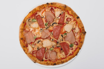 whole pizza with different meat toppings