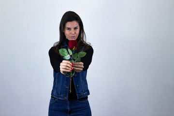Portrait of fashionable middle age woman modelrose pointing with fore finger the object, isolated...