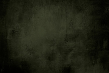 green grunge background or texture with dark vignette borders and spotlight