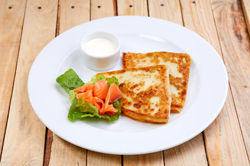 stuffed pancake with cheese and salmon