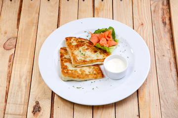 stuffed pancake with cheese and salmon