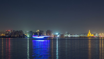 Fototapeta na wymiar Doha skyline with the Islamic Cultural Center timelapse in Qatar, Middle East