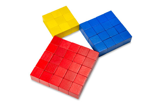 Pythagorean theorem shown with colorful wooden cubes, side view. Pythagoras theorem. Relation of sides of a right triangle. The two smaller squares together have the same area than the big one. Photo.