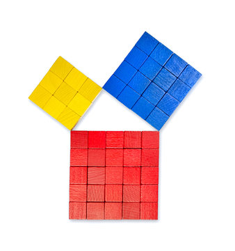 Pythagorean theorem shown with colorful wooden cubes, from above. Pythagoras theorem. Relation of sides of a right triangle. The two smaller squares together have the same area than the big one. Photo