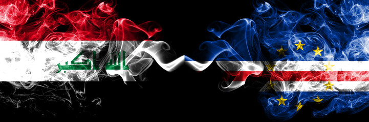 Iraq, Iraqi vs Cape Verde smoky mystic flags placed side by side. Thick colored silky smokes flags together.