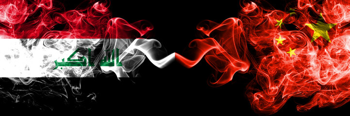 Iraq, Iraqi vs China, Chinese smoky mystic flags placed side by side. Thick colored silky smokes flags together.