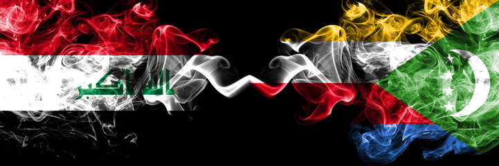 Iraq, Iraqi vs Comoros, Comorian smoky mystic flags placed side by side. Thick colored silky smokes flags together.