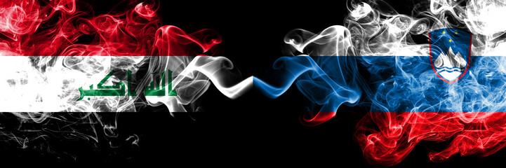 Iraq, Iraqi vs Slovenia, Slovenian smoky mystic flags placed side by side. Thick colored silky smokes flags together.