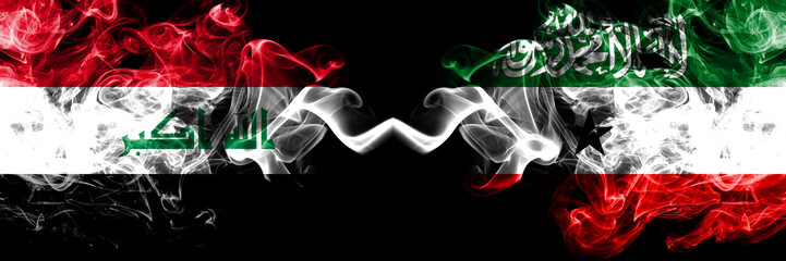 Iraq, Iraqi vs Somaliland smoky mystic flags placed side by side. Thick colored silky smokes flags together.