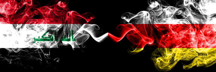 Iraq, Iraqi vs South Ossetia smoky mystic flags placed side by side. Thick colored silky smokes flags together.