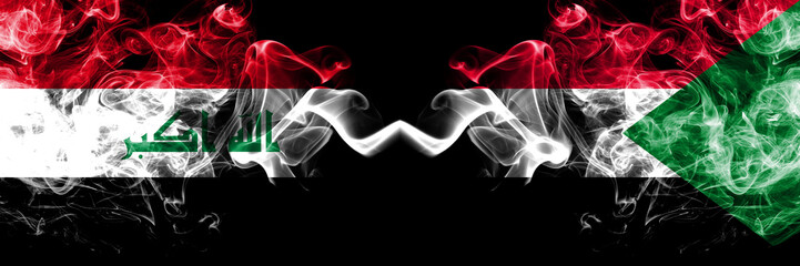 Iraq, Iraqi vs Sudan, Sudanese smoky mystic flags placed side by side. Thick colored silky smokes...