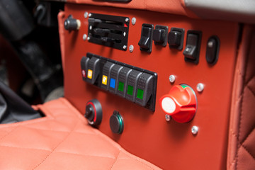 Toggle switches and buttons on the car control panel to turn on additional equipment and increase power when driving on off-road, racing and rally.