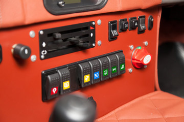 Toggle switches and buttons on the car control panel to turn on additional equipment and increase...