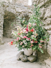 Fototapeta na wymiar Wedding flowers, bridal bouquet closeup. Decoration made of roses, peonies and decorative plants