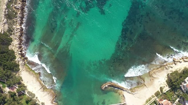Aerial top shot Martigues provence mediterranean sea waves crushing on the shore blue water 