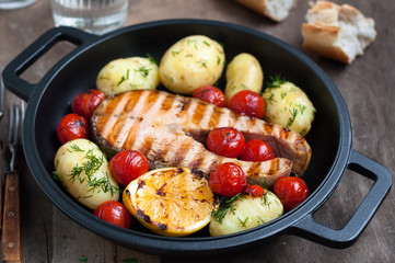Grilled Wild Salmon Steak with Potatoes and Tomatoes