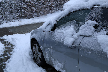 A Car covered with fresh white snow