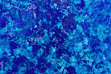 Fototapeta na wymiar Bright abstract paint background in blue and its shades.