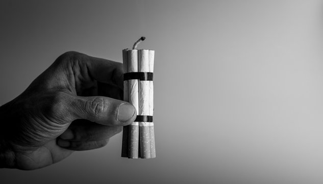 Man smoker.Cigarette like time bomb.Cigarettes is addictive to be cancer.smoking reduction campaign in World No Tobacco Day.