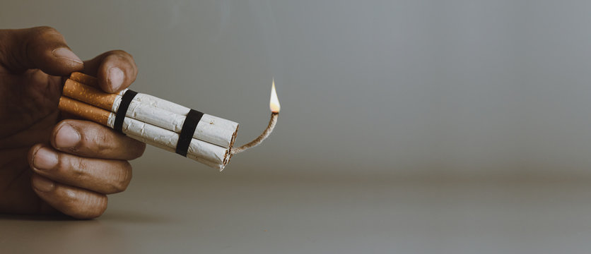 Man smoker.Cigarette like time bomb.Cigarettes is addictive to be cancer.smoking reduction campaign in World No Tobacco Day.