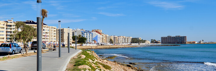 Fototapeta na wymiar Horizontal image promenade along Mediterranean Sea, Torrevieja, Spain