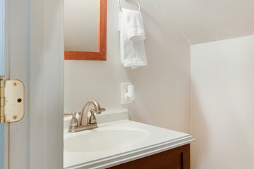 Fototapeta na wymiar White bathroom with bronze fixtures